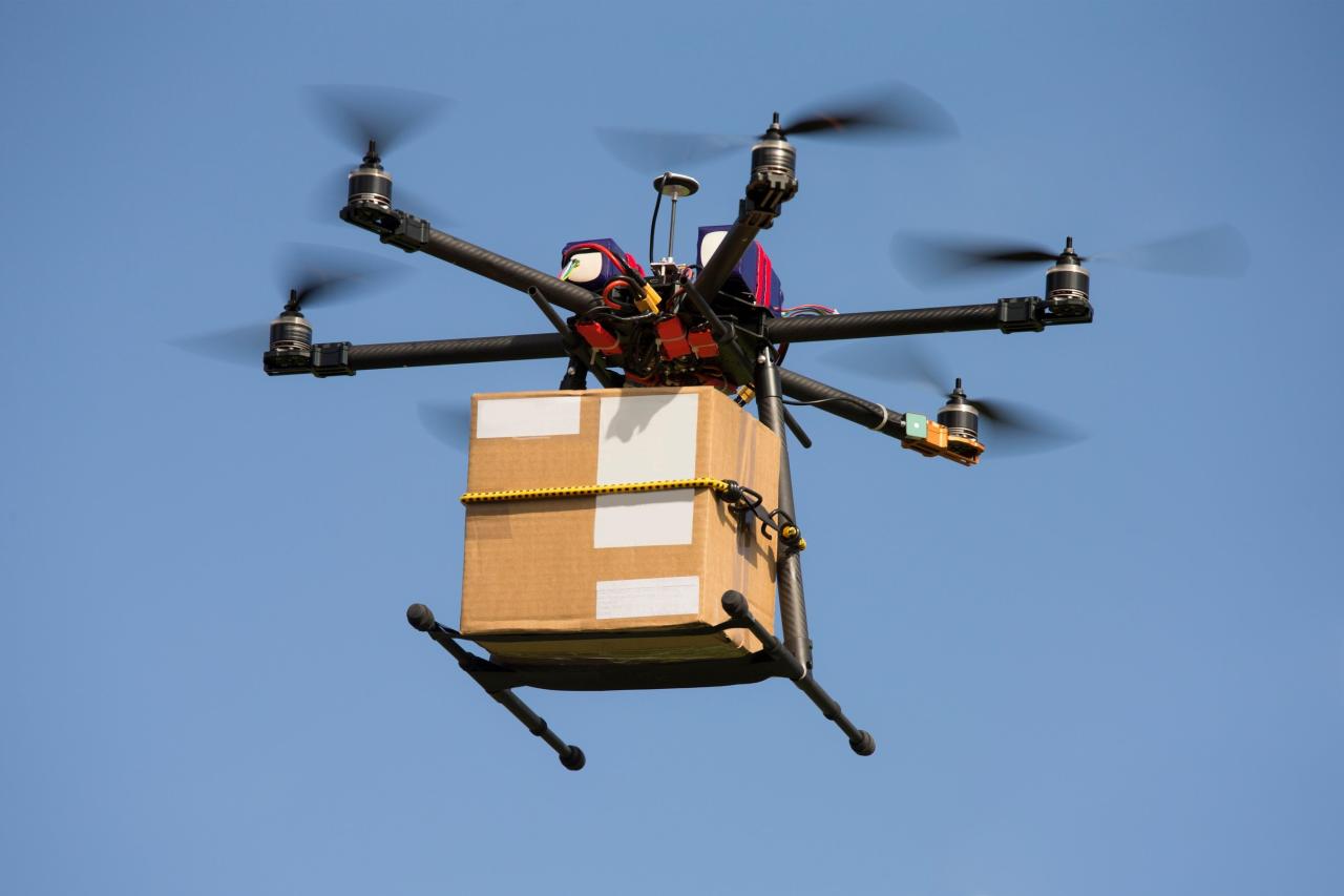 Amazon drone delivery cnn picking package drones dropping gonna sky start would work warehouse shows video story